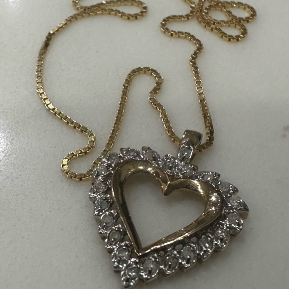 This is a yellow gold open heart diamond pendant necklace on a gold chain - Picture 2 of 8